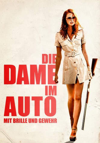 Die Dame im Auto mit Brille und Gewehr