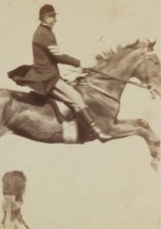 Horse and Rider Jumping Over an Obstacle